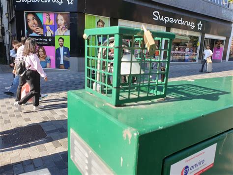 green metal boxes on streets